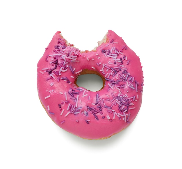 Tasty bitten glazed donut decorated with sprinkles isolated on white top view