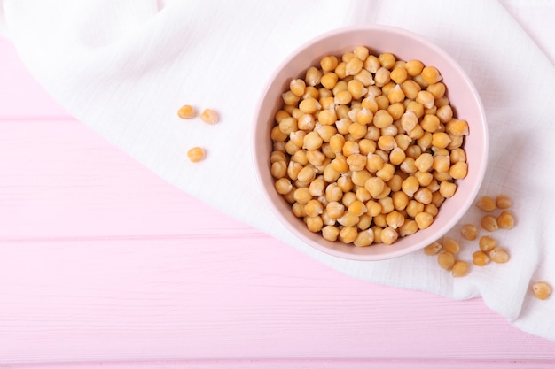 Tasty boiled chickpeas on the table closeup