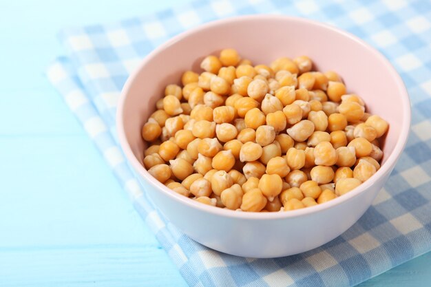 Tasty boiled chickpeas on the table closeup