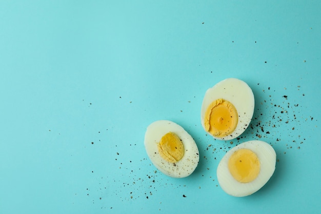 Tasty boiled eggs on blue