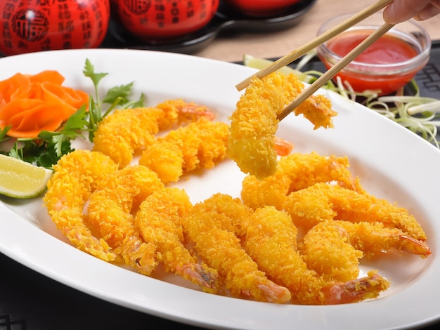 Tasty breaded tiger prawns in sweet and sour sauce