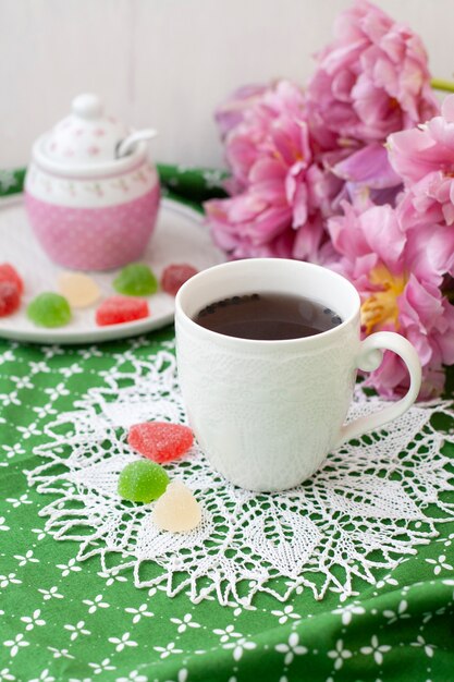 tasty break. cup of tea with jelly beans.