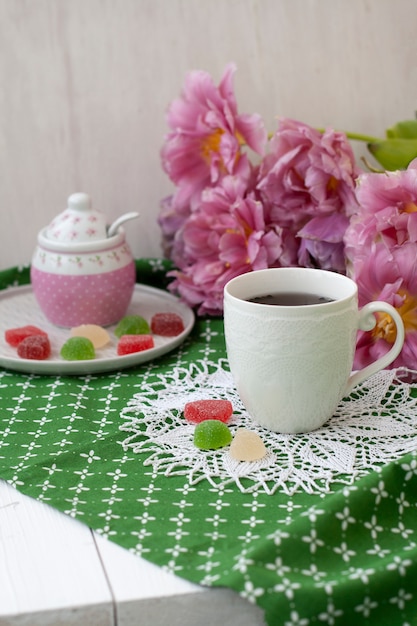 tasty break. cup of tea with jelly beans.