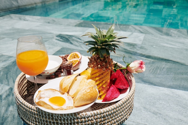 Tasty breakfast in wicker tray