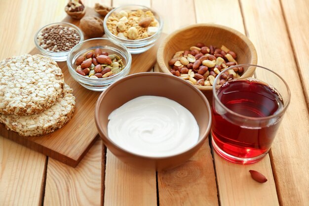 Tasty breakfast with yogurt on table