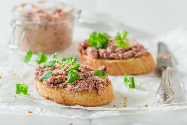 Tasty bruschetta with fegatini and herbs for a breakfast