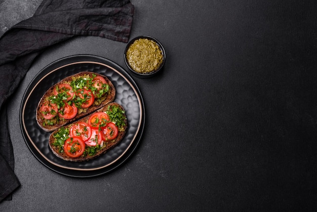 Tasty bruschetta with tomatoes mozzarella basil spices and herbs