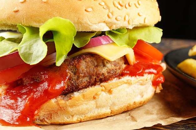 Tasty burger closeup Burger with tomatoes greens onions and meat