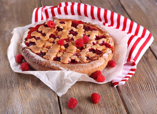 Tasty cake with berries on table close-up