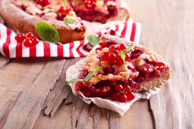 Tasty cake with berries on table closeup