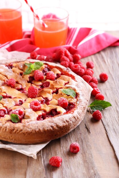 Tasty cake with berries on table closeup