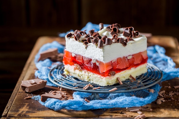 Tasty cake with jelly chocolate chips and fruits