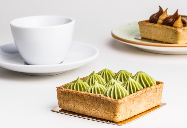 Tasty cakes and tea  on table, close-up