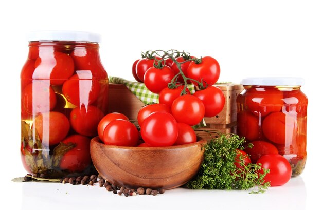 Tasty canned and fresh tomatoes isolated on white