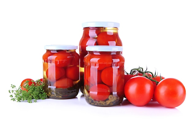 Tasty canned and fresh tomatoes isolated on white