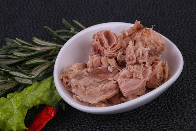 Tasty canned tuna fish in the bowl served salad leaves