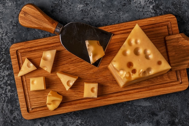 Tasty cheddar on a cutting board