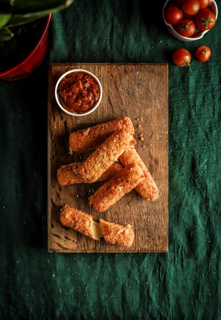 Photo tasty cheese sticks a mouthwatering shot of cheese sticks showcasing their crispy exterior