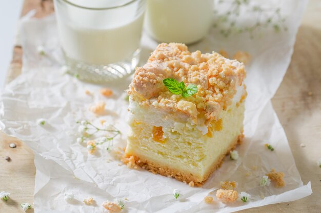 Tasty cheesecake with fresh peach and crumble