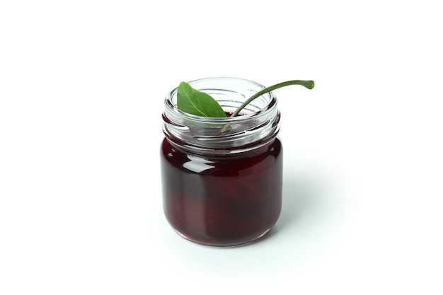 Tasty cherry jam isolated on white background