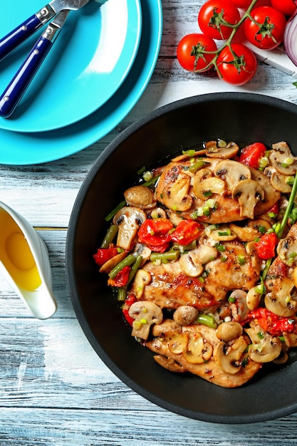 Tasty chicken marsala on pan on table