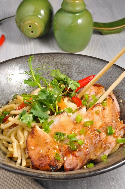 Tasty chicken noodles in an Asian restaurant