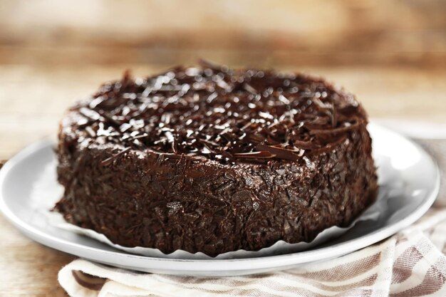 Tasty chocolate cake on wooden background