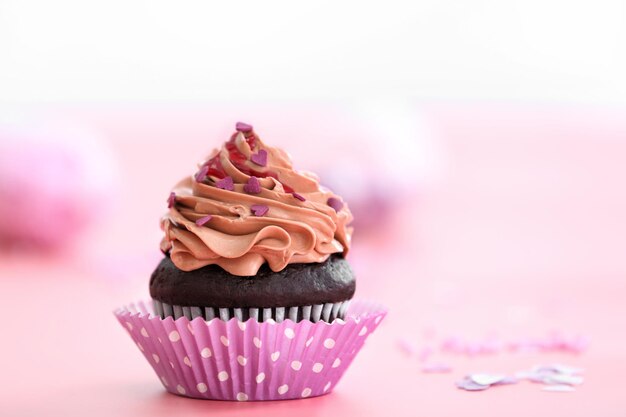 Tasty chocolate cupcake for Valentine's Day on table