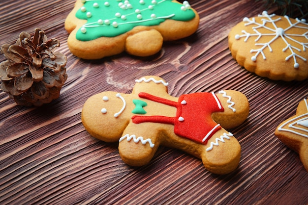 Tasty Christmas cookies on wooden table, close up view