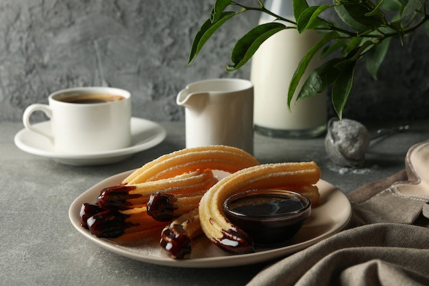 Tasty churros with chocolate sauce