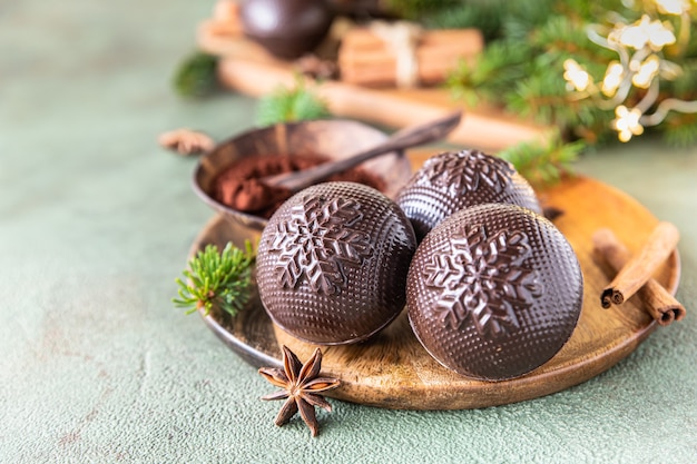 tasty cocoa bombs with marshmallow and chocolate with spices trendy winter hot drink