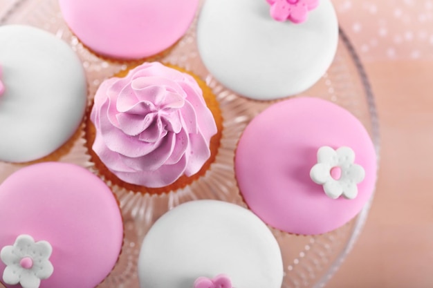 Tasty cupcake on stand closeup