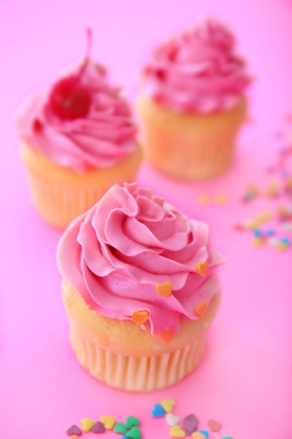 Tasty cupcake for valentine's day on pink background