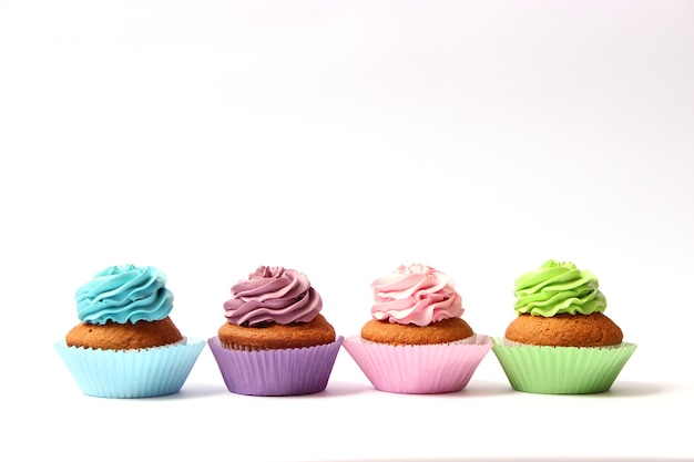 Tasty cupcakes on a white background closeup