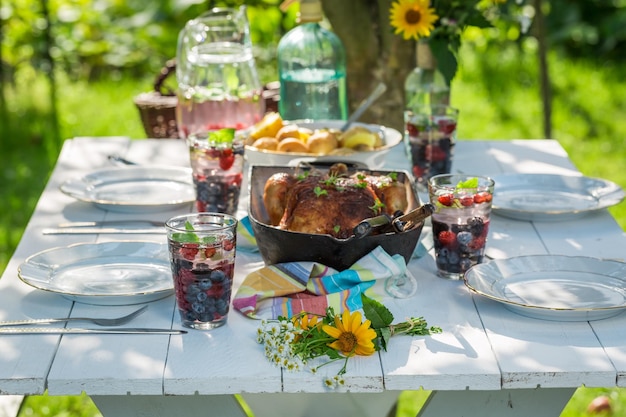 Tasty dinner with chicken and potatoes served in sunny day