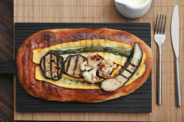 Tasty dish of grilled vegetables and baked bread