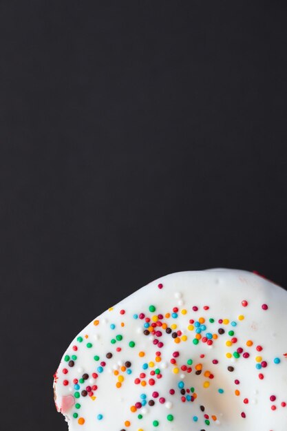 Tasty donuts on black background