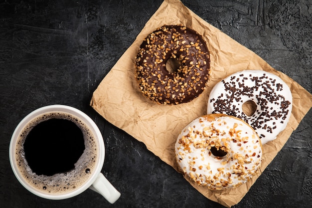 Tasty donuts on dark background