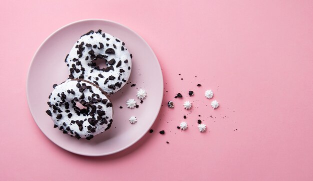 Tasty donuts on a white plate