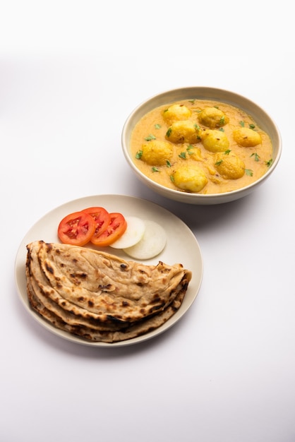 Tasty Dum Aloo or whole potatoes spicy curry is a popular main course recipe from India