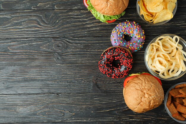 Tasty fast food on rustic wooden table