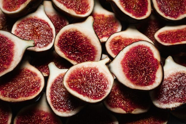 Tasty figs background. Top view. Slices.