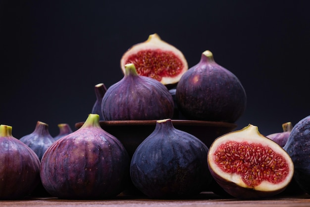 Tasty figs on a black background. Top view. Slices.