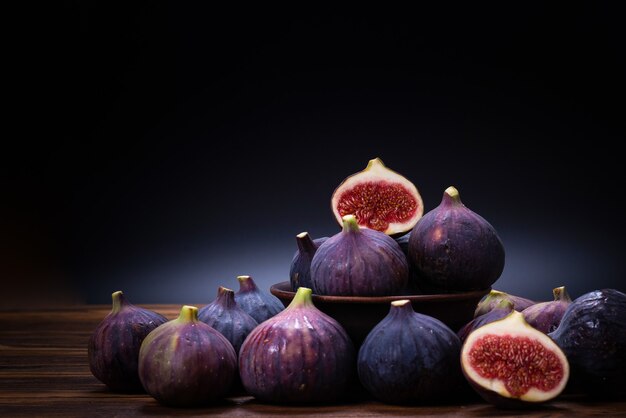 Tasty figs on a black background. Top view. Slices.