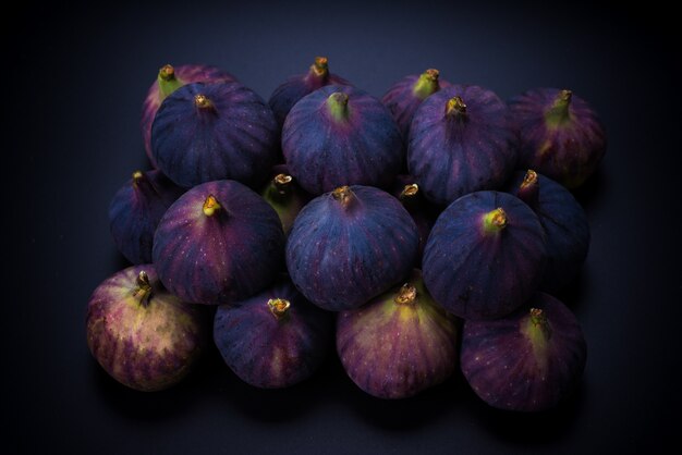 Tasty figs on a black background