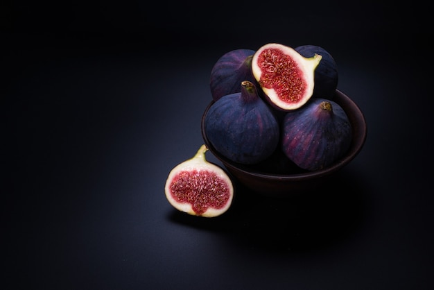 Tasty figs isolated on black