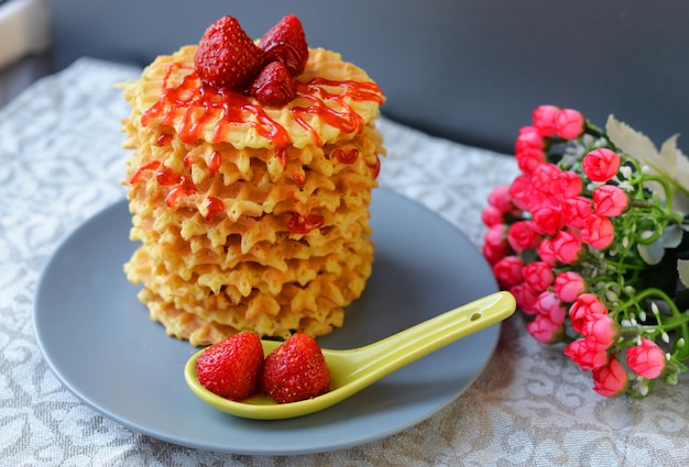 Tasty food sweet waffles with strawberries 