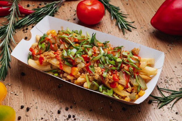 Tasty french fries poutine in box