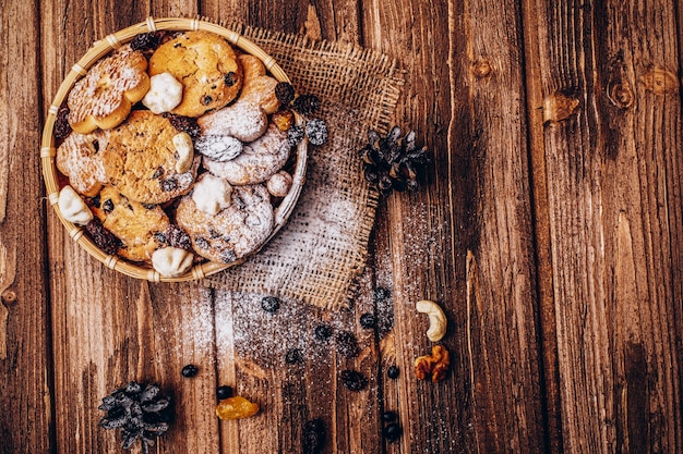 Tasty fresh baked cookies with berries on the wooden table 