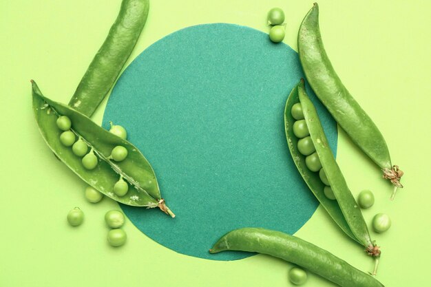 Tasty fresh peas on green background